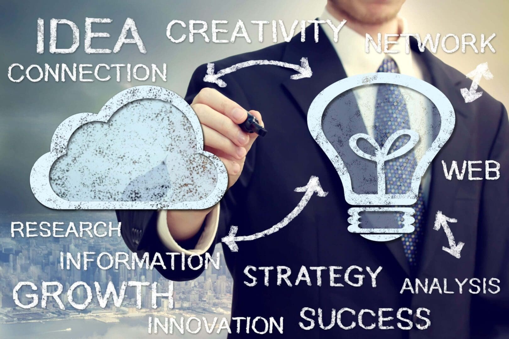 Businessman drawing cloud and lightbulb icons representing creativity and strategy.
