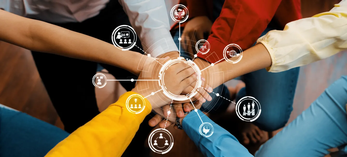 Diverse hands joined in unity, surrounded by teamwork icons.